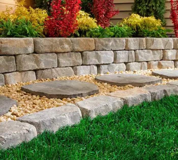 Garden path made from Oldcastle Epic Stone pavers, winding through a well-manicured lawn from Home Depot.